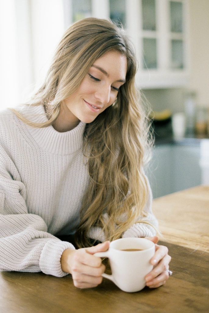 woman gazing at coffee romantically
