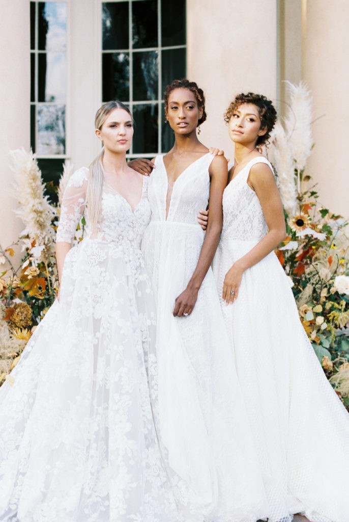 three brides posing