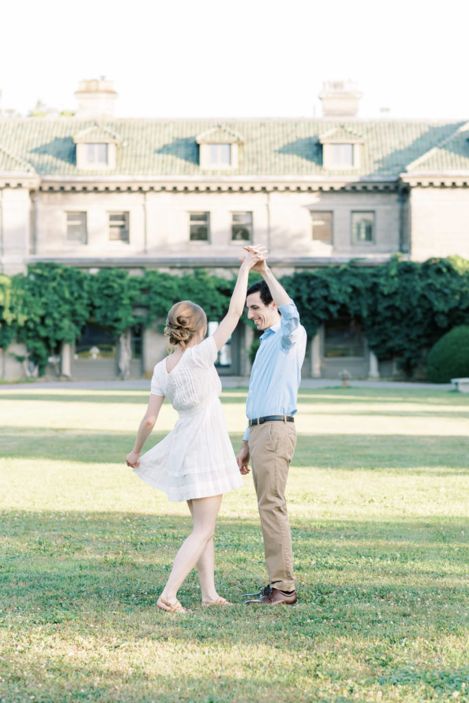 twirling in front of Eolia Mansion at Harkness Memorial Engagement Session