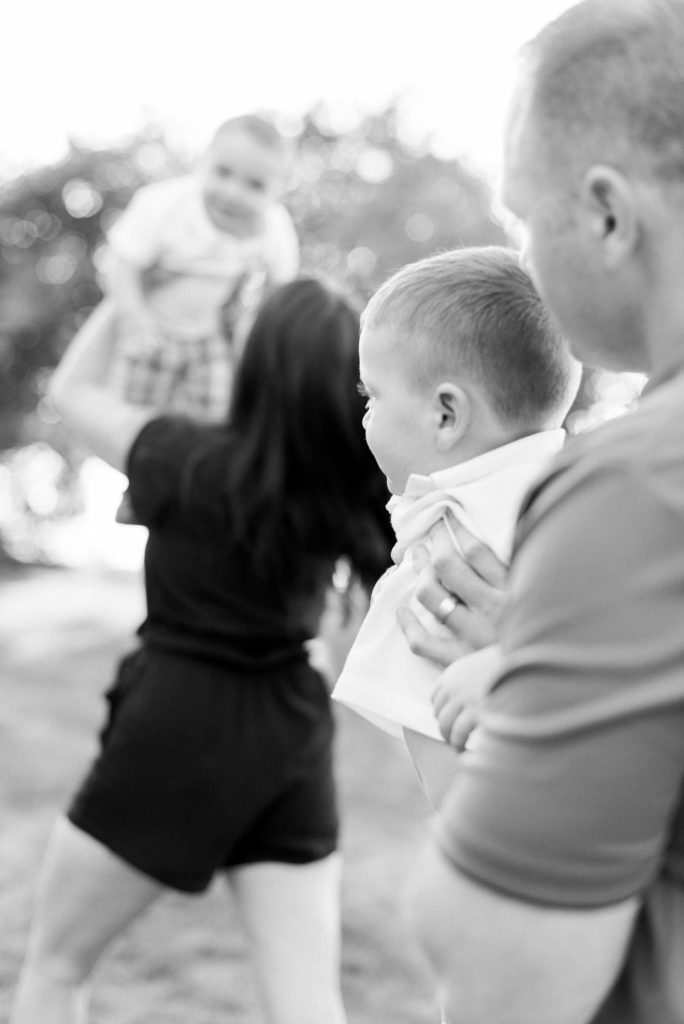 mom and dad playing airplane
