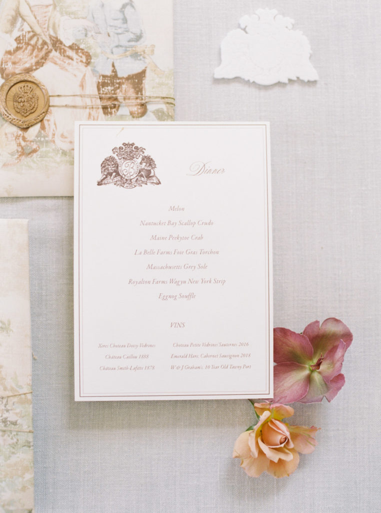 close up of ocean house wedding invitation