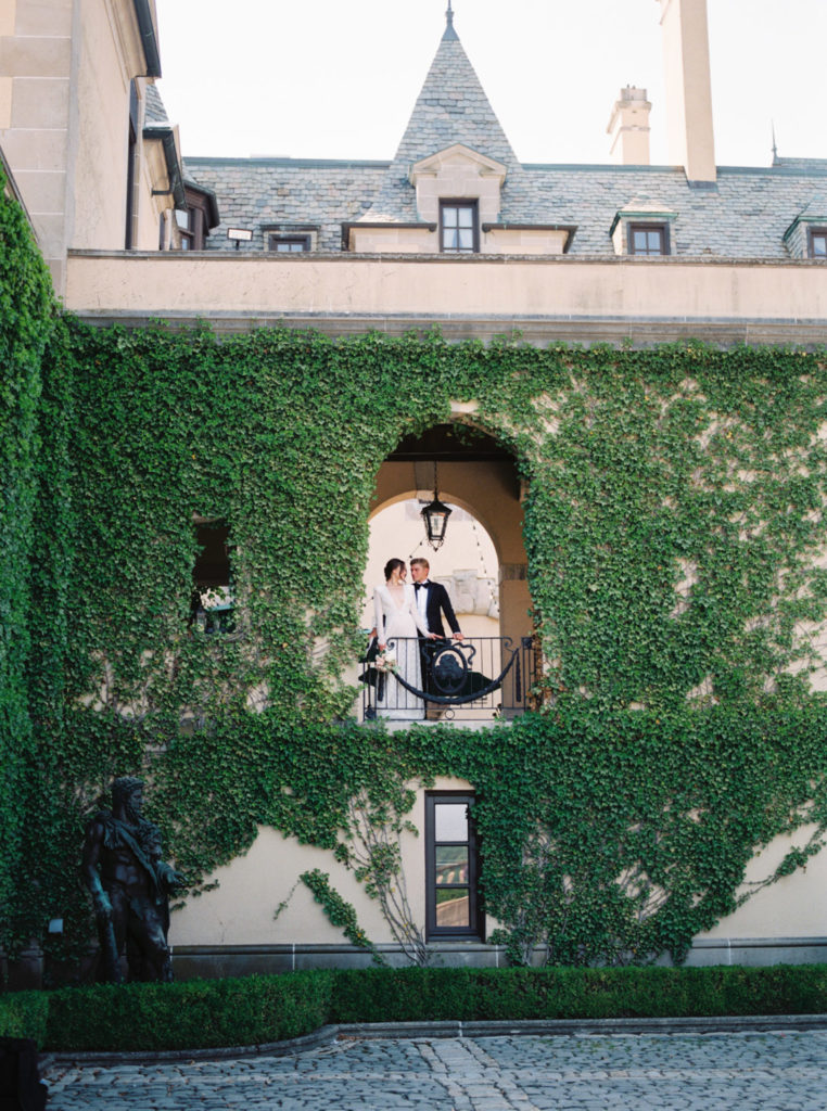 Oheka Castle Wedding bride and groom looking out window