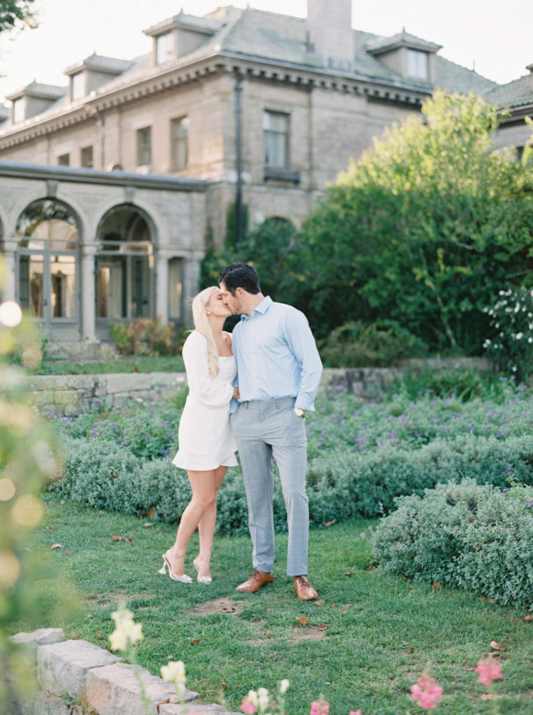 kissing in the garden at Harkness Memorial engagement session