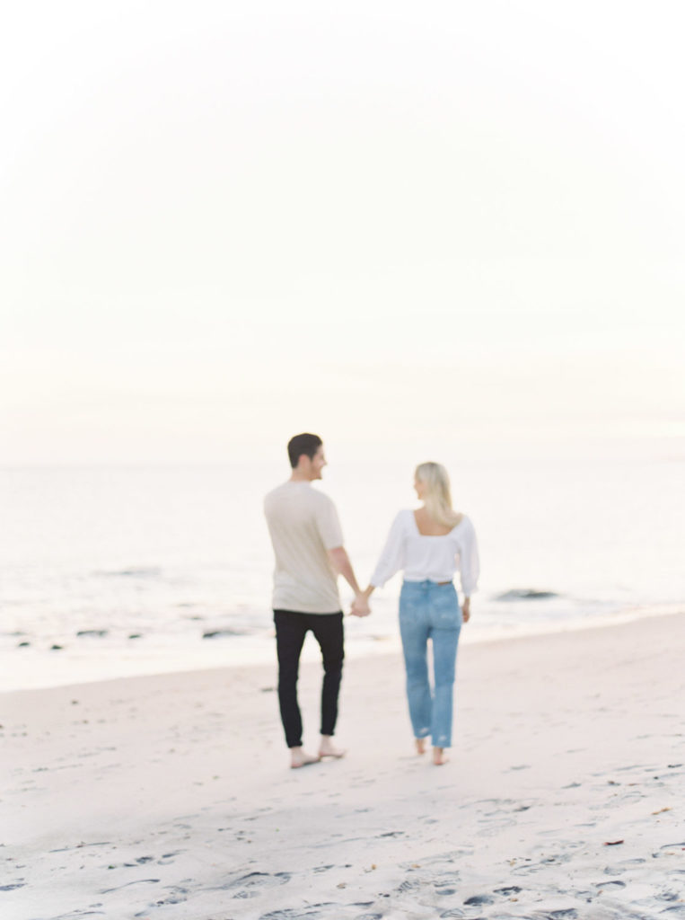 off to the beach at Harkness Memorial engagement session