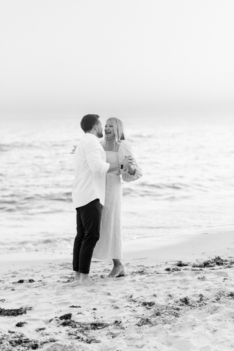 black and white sweet moment by the water