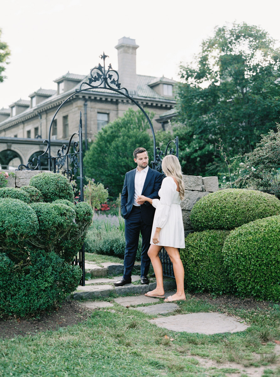 leading her into the garden at this Connecticut engagement session