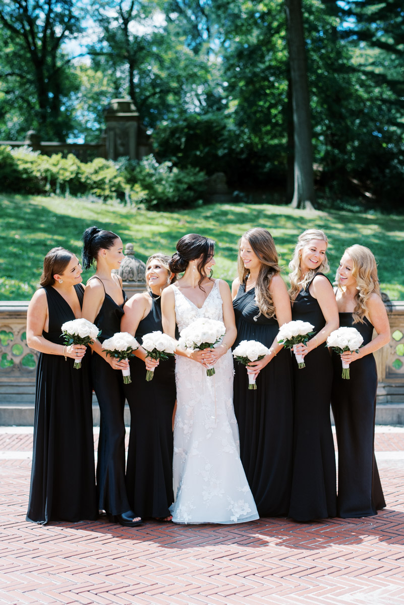 the bridal party looking at each other laughing