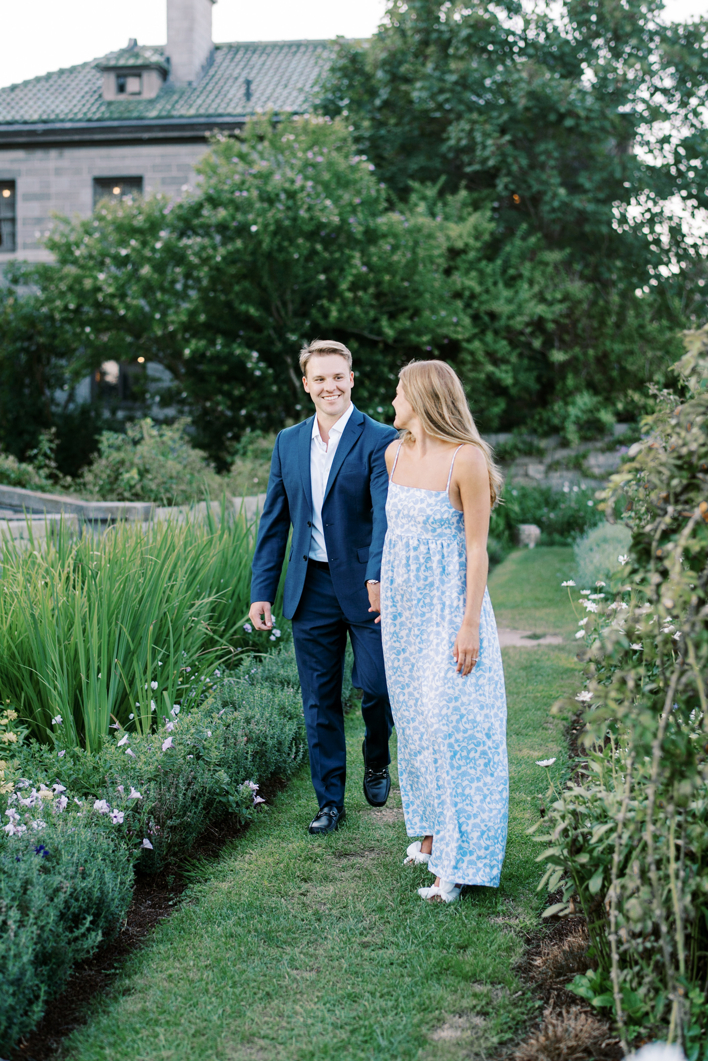 bride and groom walking in the garden