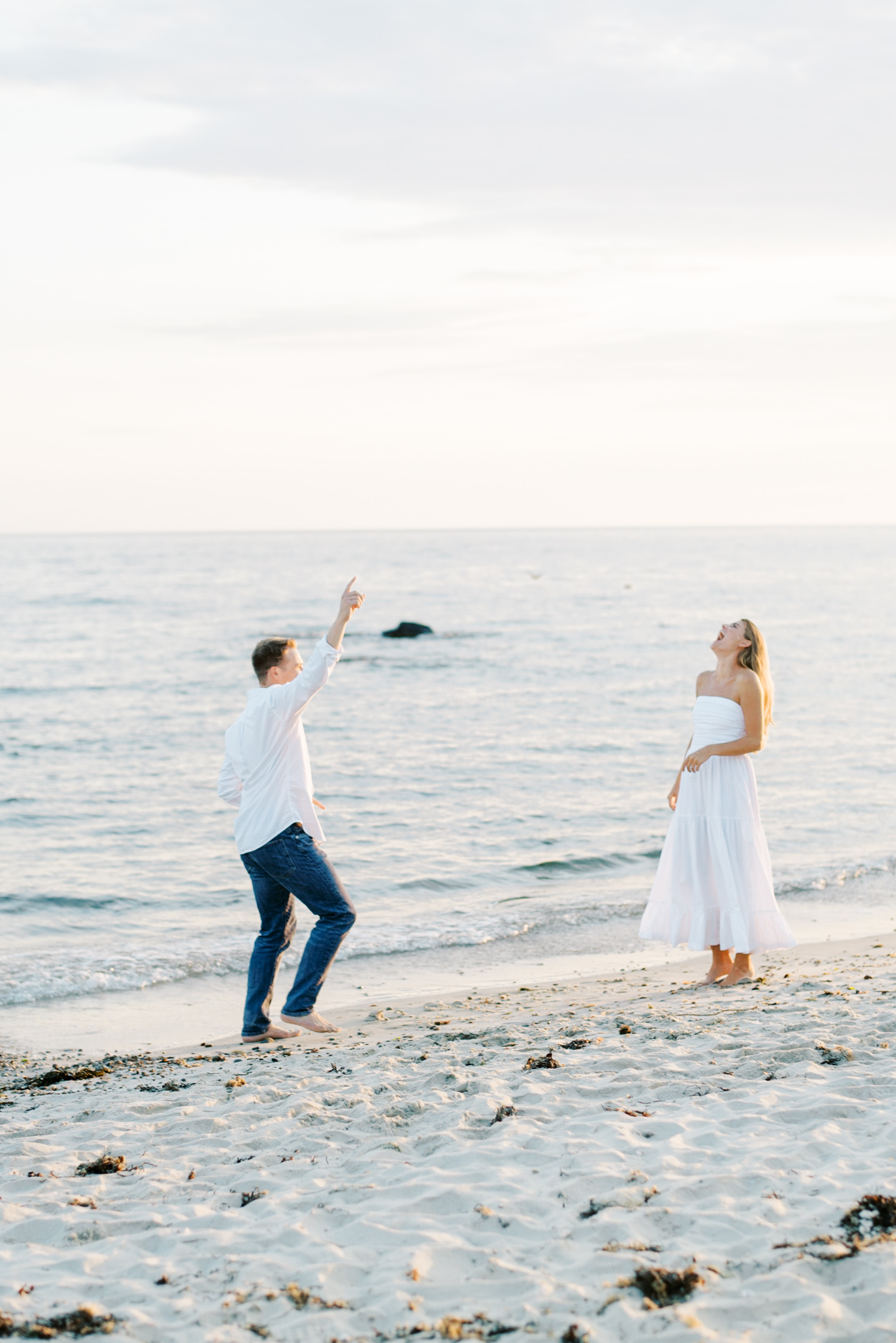 bride and groom dancing on the beach