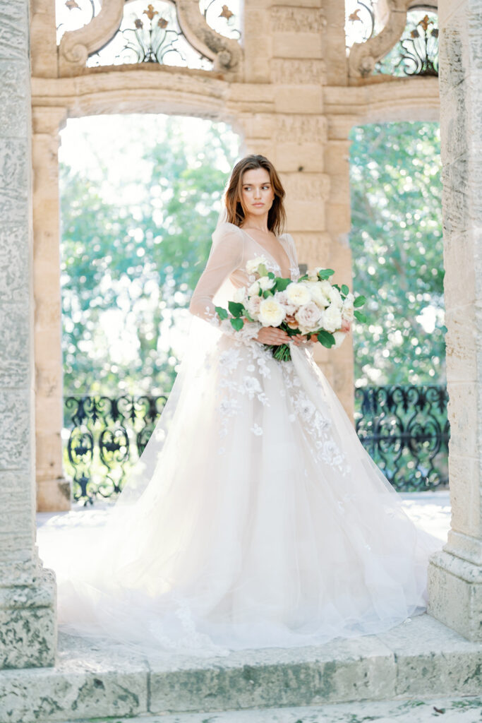 Portrait of the bride at Vizcaya with her bouquet.