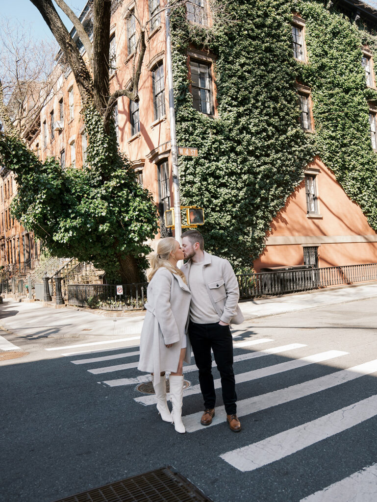 The couple kissing in the middle of the street.