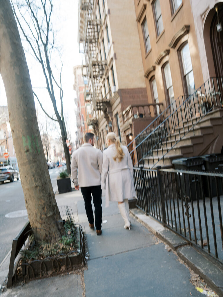 The couple walking away from the camera just engaged.