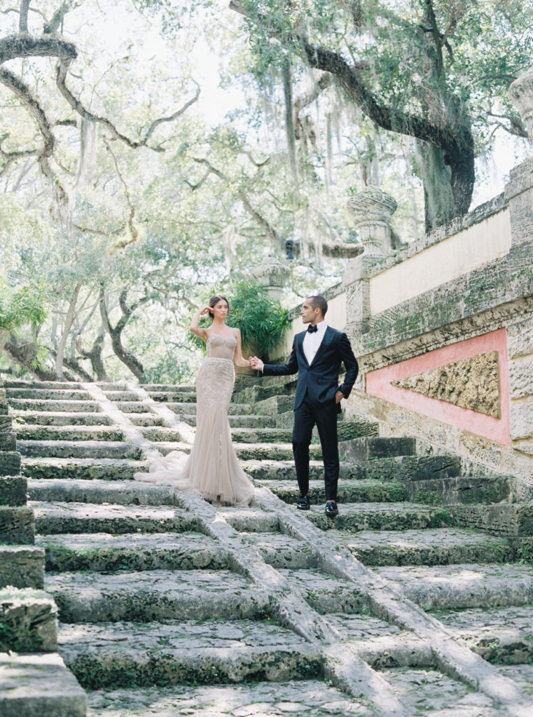 bride and groom on stairs at vizcaya wedding