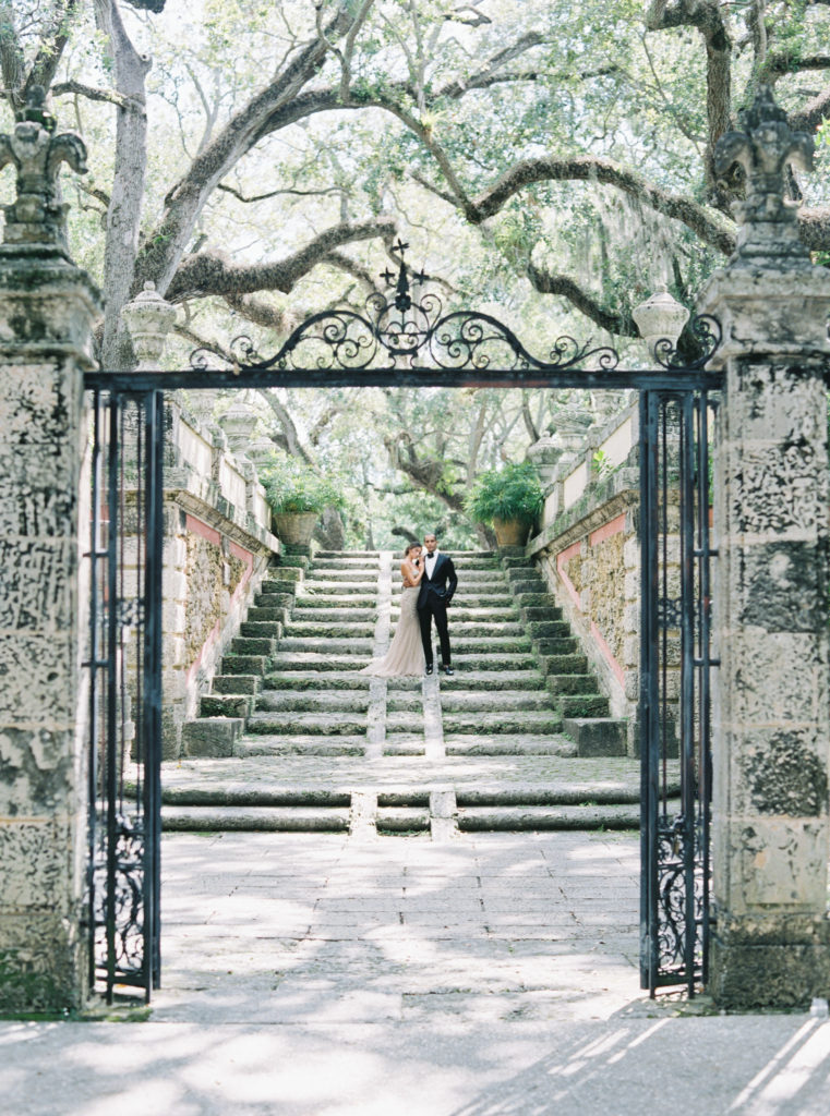bride and groom through the gate