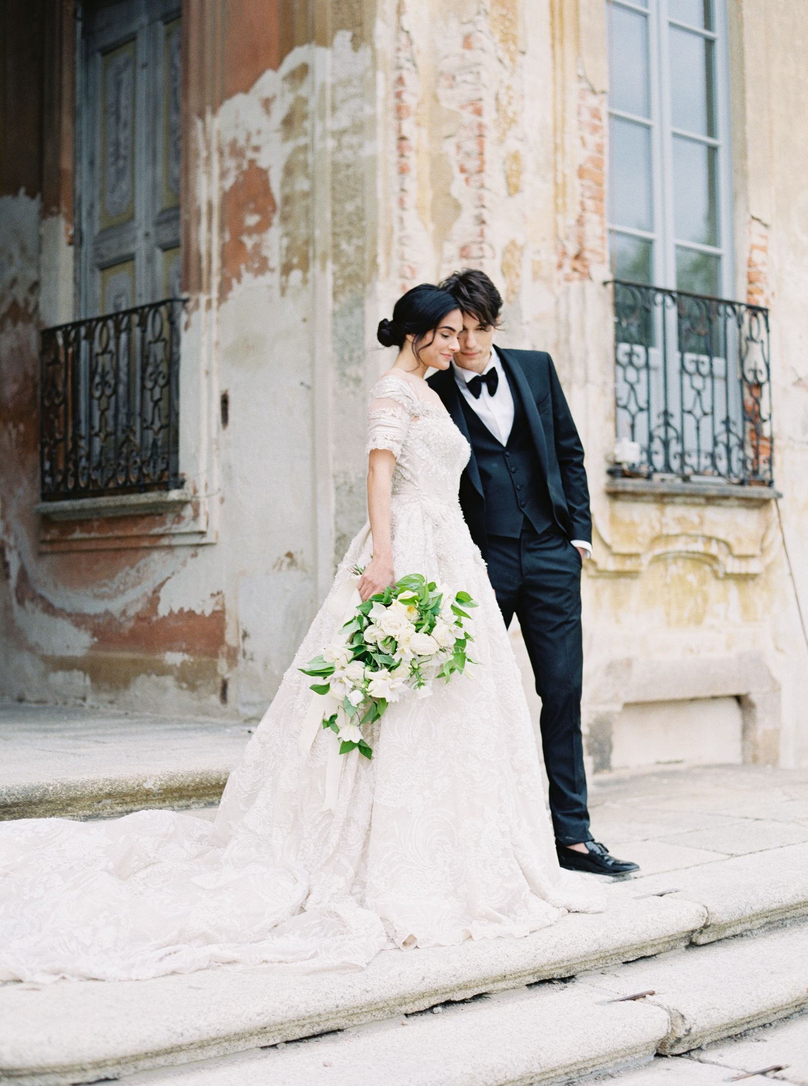 Bride and groom standing at the door of Villa Arconati, one of the best Italian wedding villas
