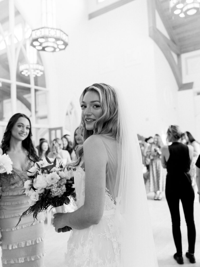 bride looking over shoulder in church after she said i do