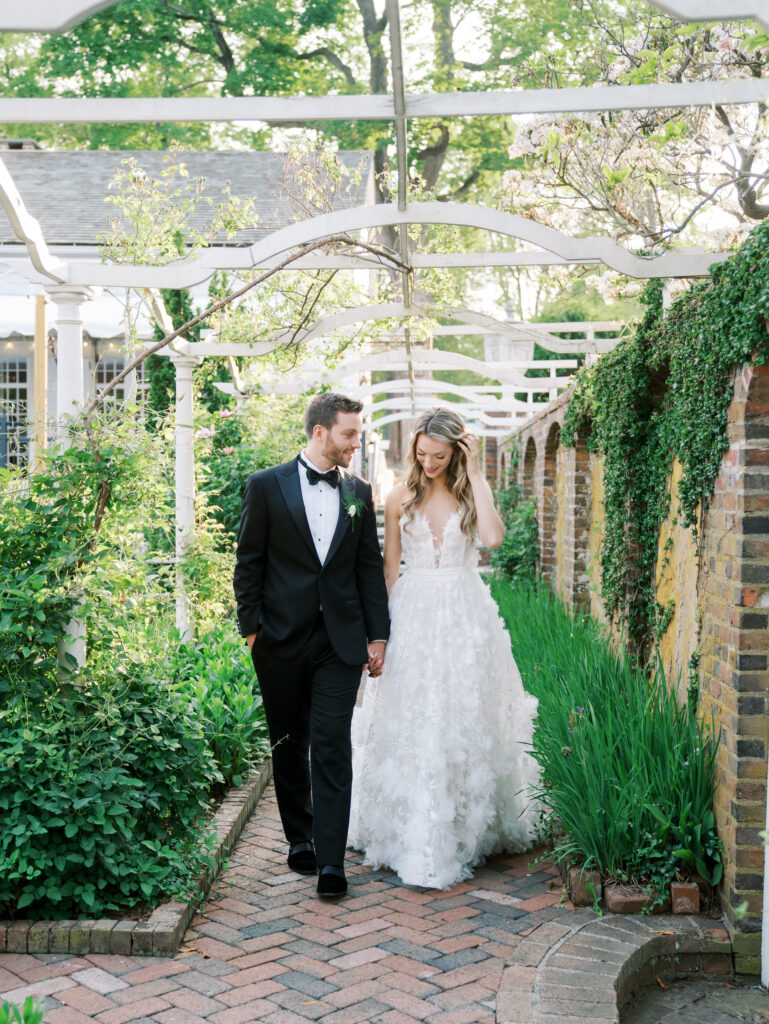 bride and groom portraits in the gardens at their keeler tavern wedding