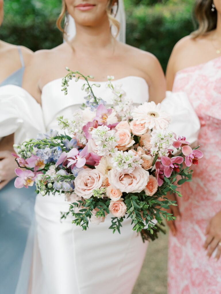 Close up of the bridal florals and the bridesmaids dresses.