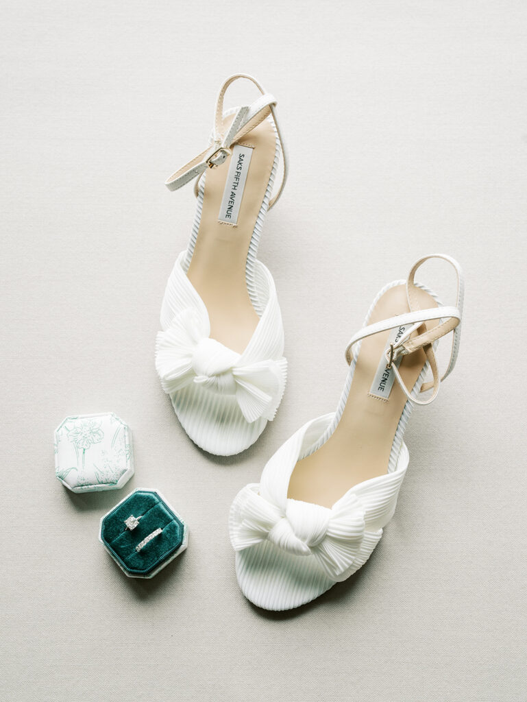 Flat lay of the shoes and rings.