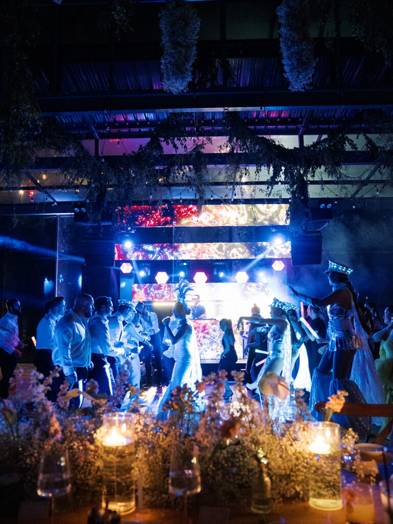 A view of the dance floor from the table with guests dancing.