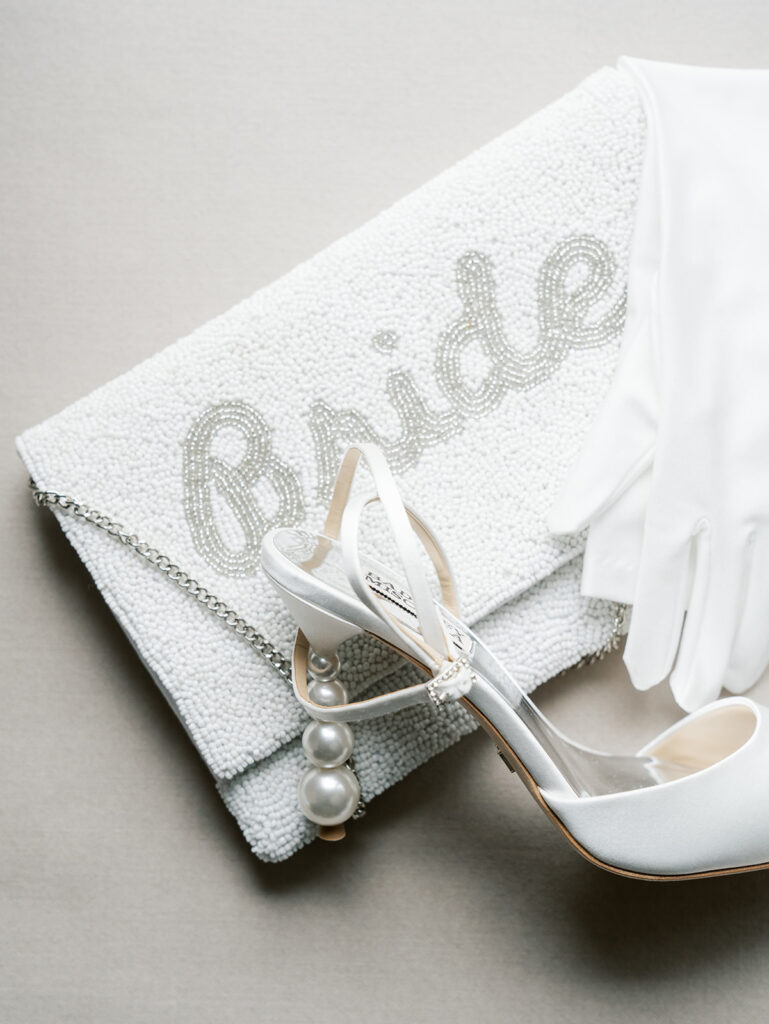 Details of the bride's shoes and bag.