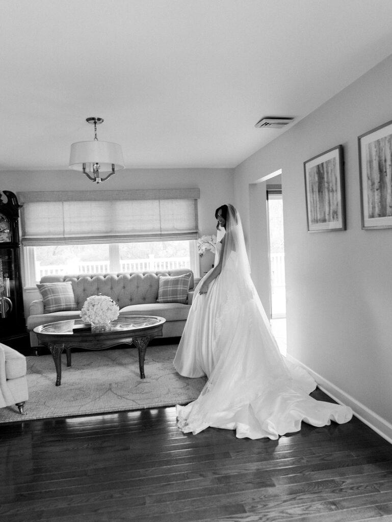 The bride in the living room of her childhood home.