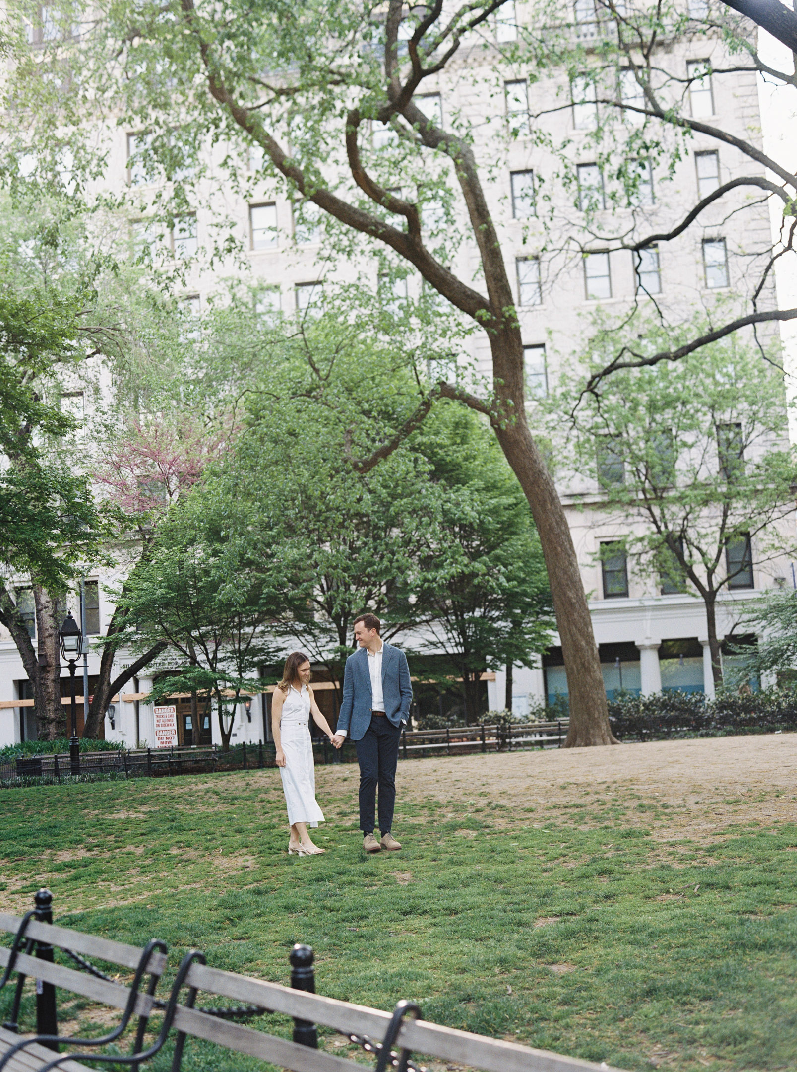 Kissing while walking during their Greenwich Village Engagement Session.