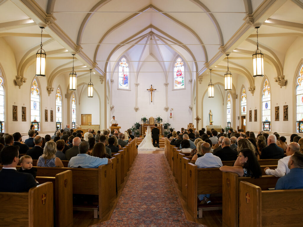 Inside the church during the ceremony for a pulled back view