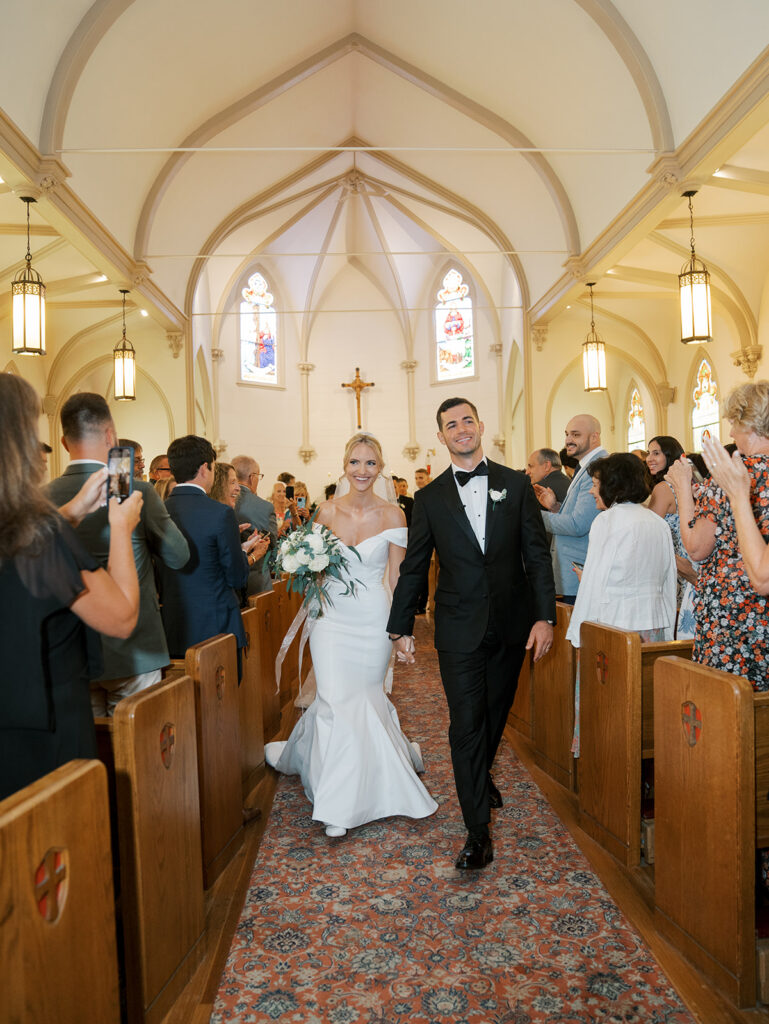 Bride and groom exiting the church after their Castle Wedding