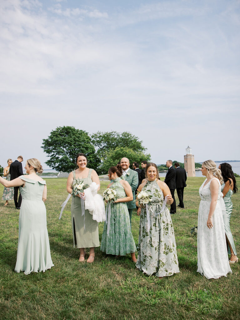 brides maids candid in the open grass