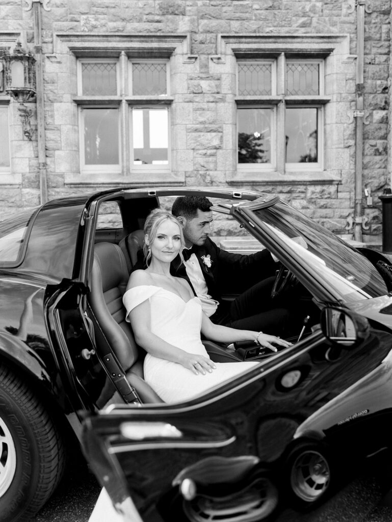 Bride in the passenger seat looking at the camera