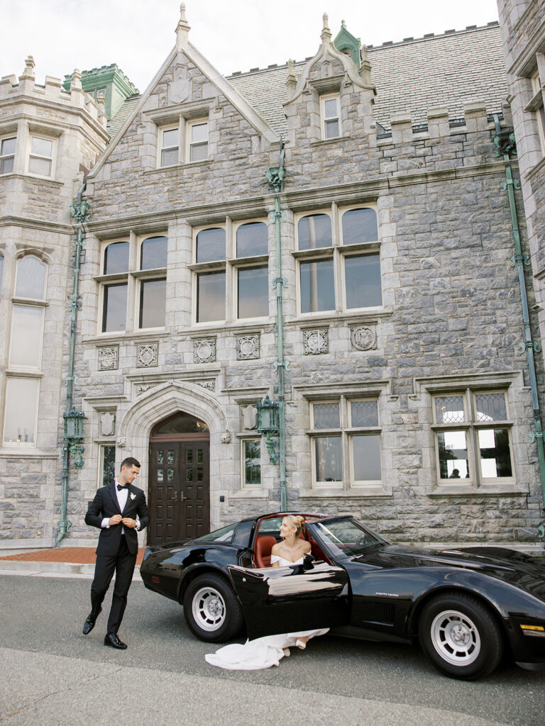 Groom coming around the car to get the bride