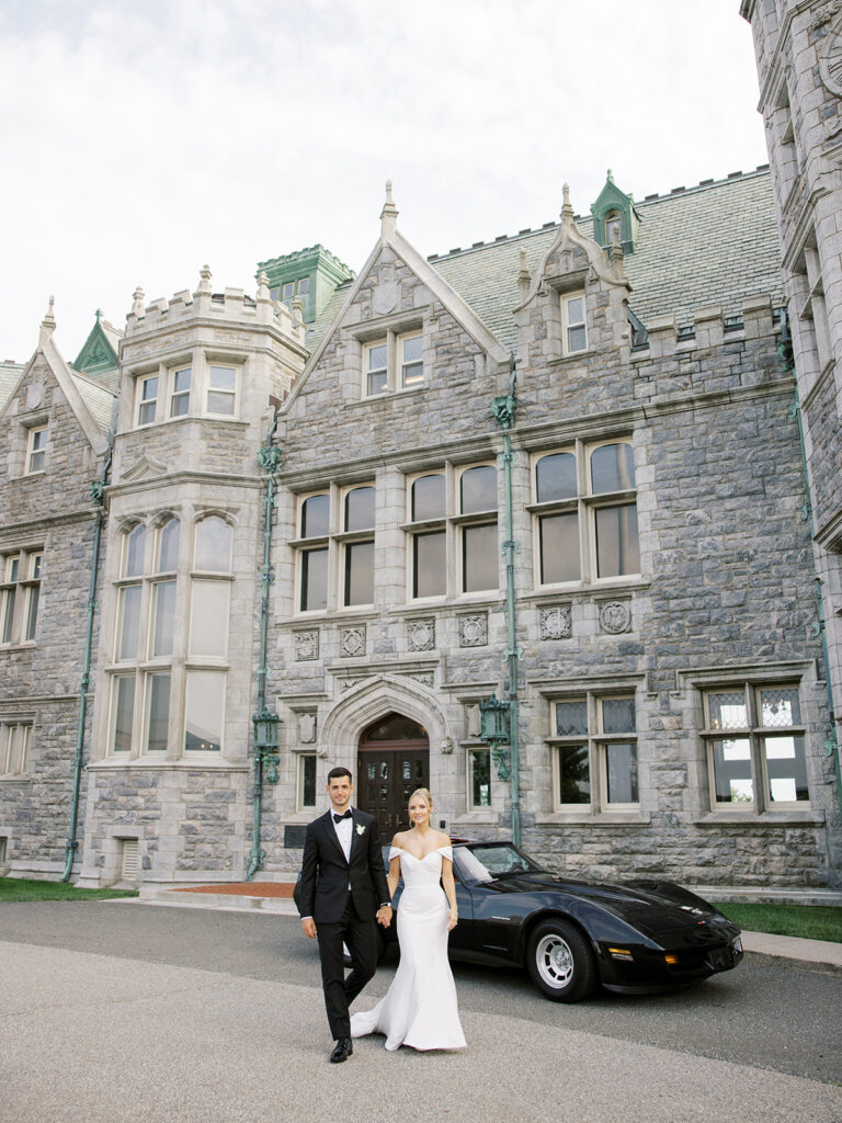 Bride and groom walking towards the camera during their portraits at their Castle Wedding