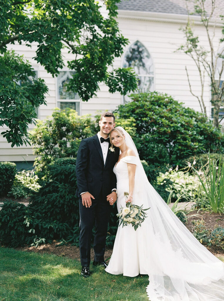 bride and groom for a formal portrait in the gardens during their Castle Wedding