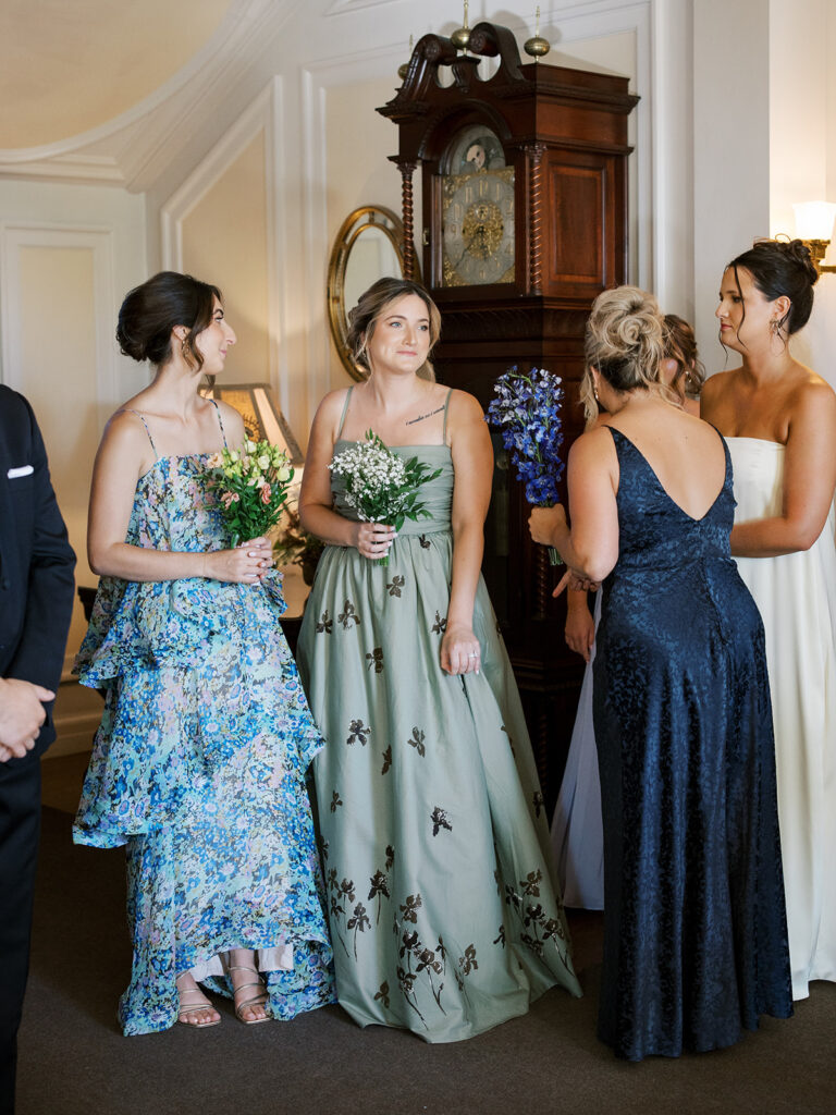 The bridesmaids waiting in the mansion before walking down the aisle.