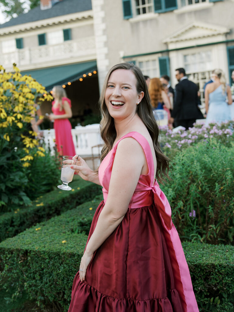 A guest laughing at the camera during cocktail hour.