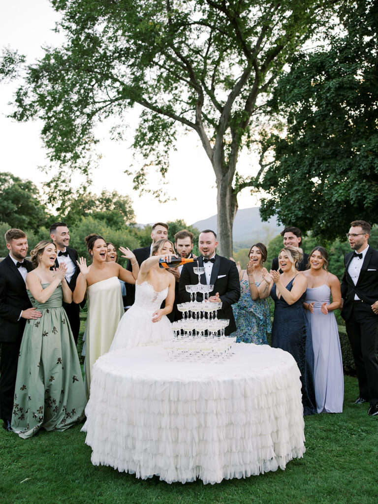 A champagne tower with the wedding party.