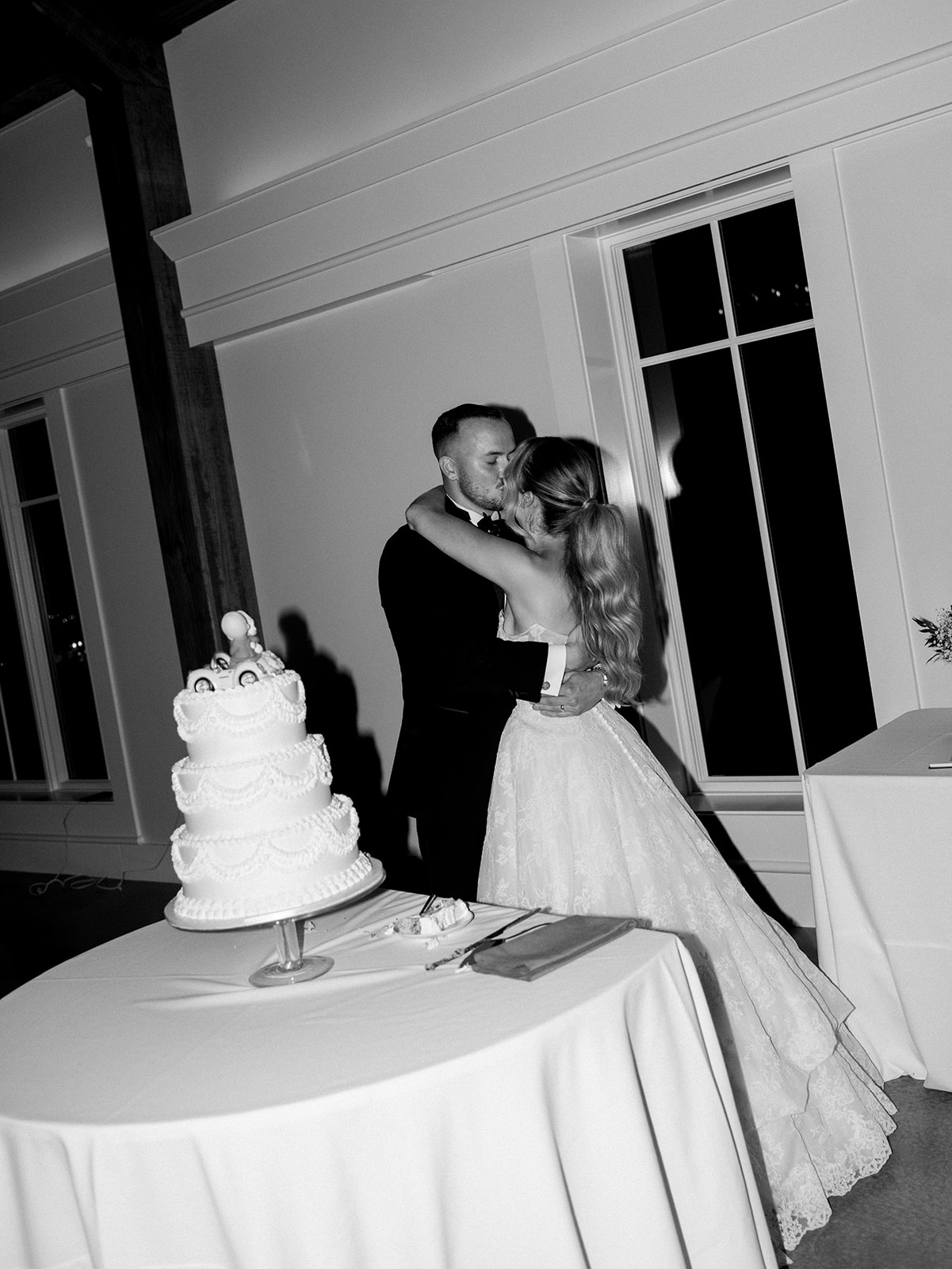 The bride and groom cutting the cake at their Hildene Wedding.