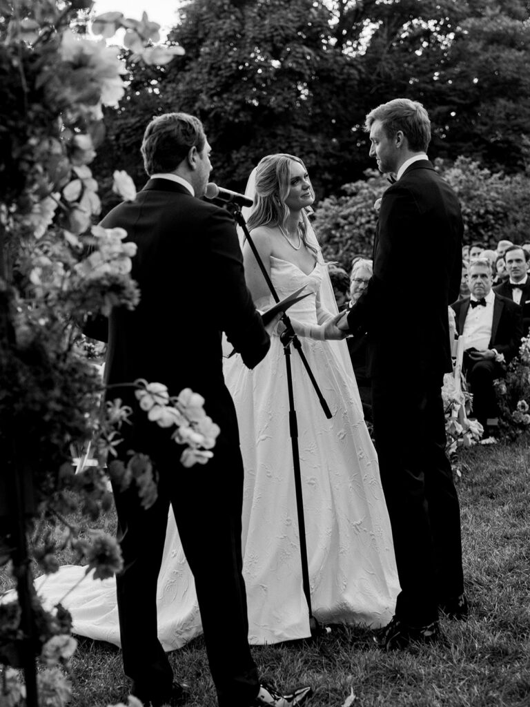 Bride looking lovingly at groom.