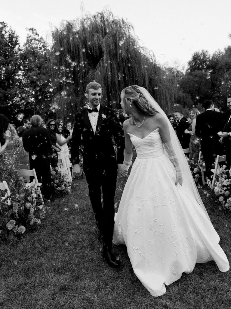 Bride and groom coming back up the aisle at their Brooklyn Botanic Wedding.