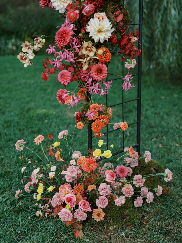 A close up of the floral arch.