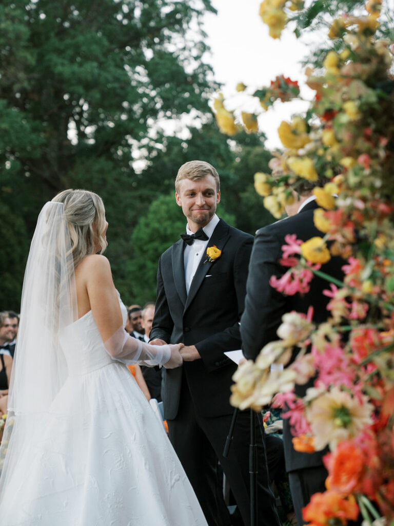 Bride and groom looking at the officiant.