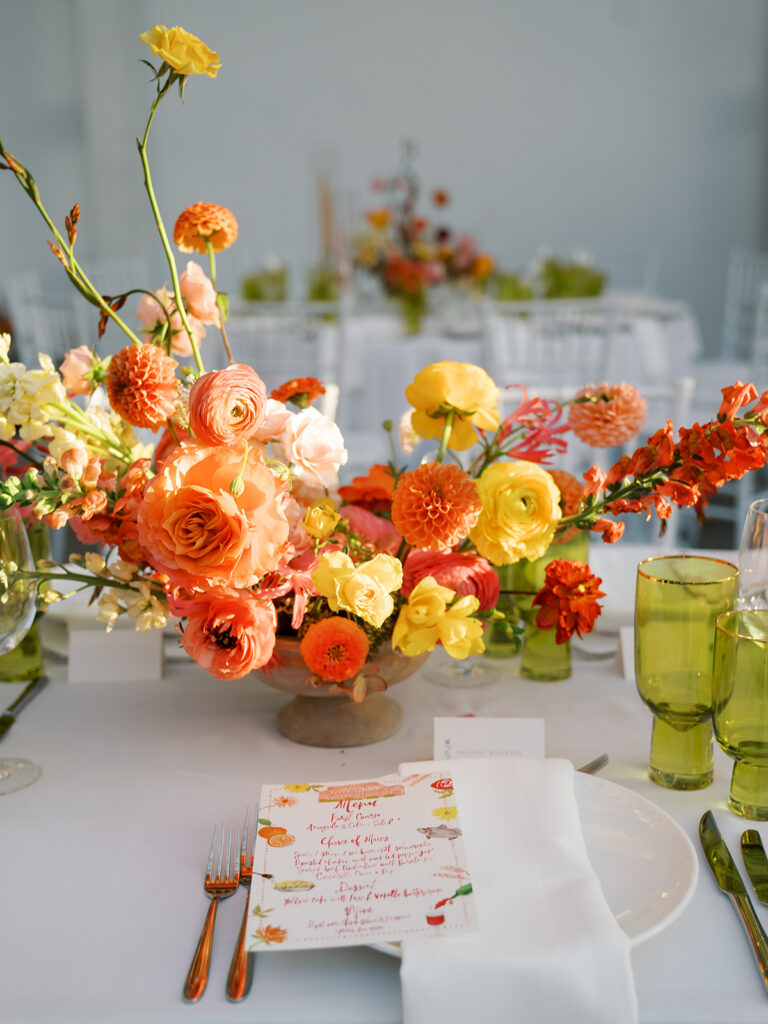 The floral arrangements on the tables.