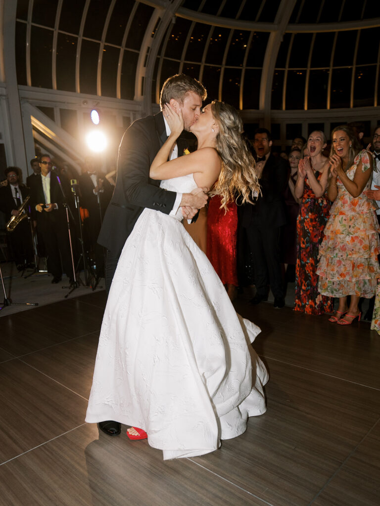 Bride and groom kissing on the dance floor at their Brooklyn Botanic WEdding