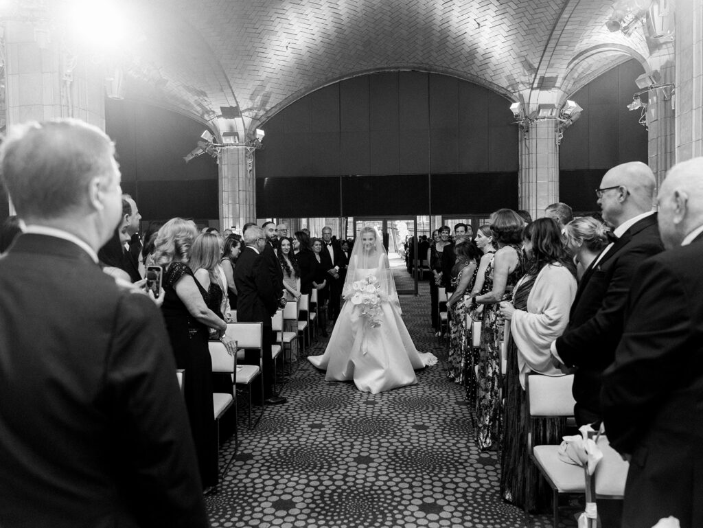 The bride walking down the aisle at her Guastavino's wedding.
