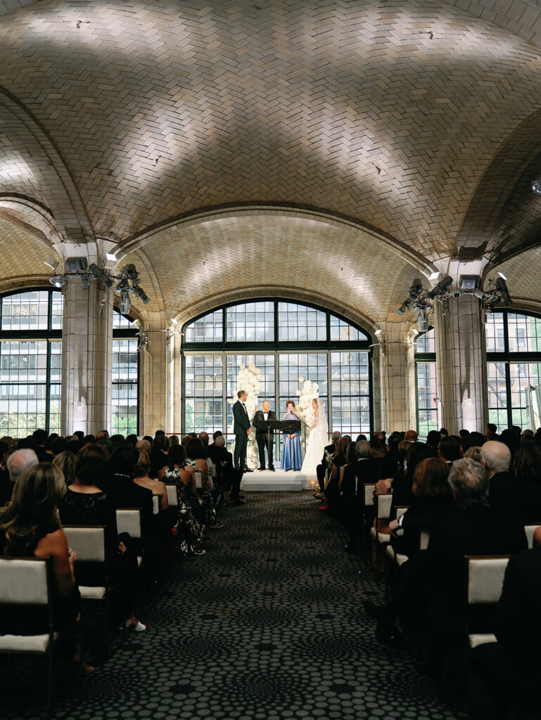 A quiet moment of the ceremony with the bride and groom at the altar.