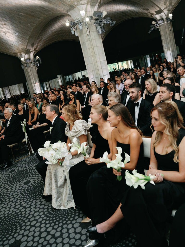 A close up shot of the guests of honor in the front row of the ceremony.