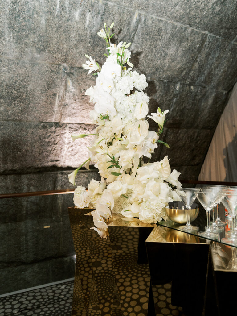 A detail photo of the floral arrangements at the bar of this Guastavino's wedding.