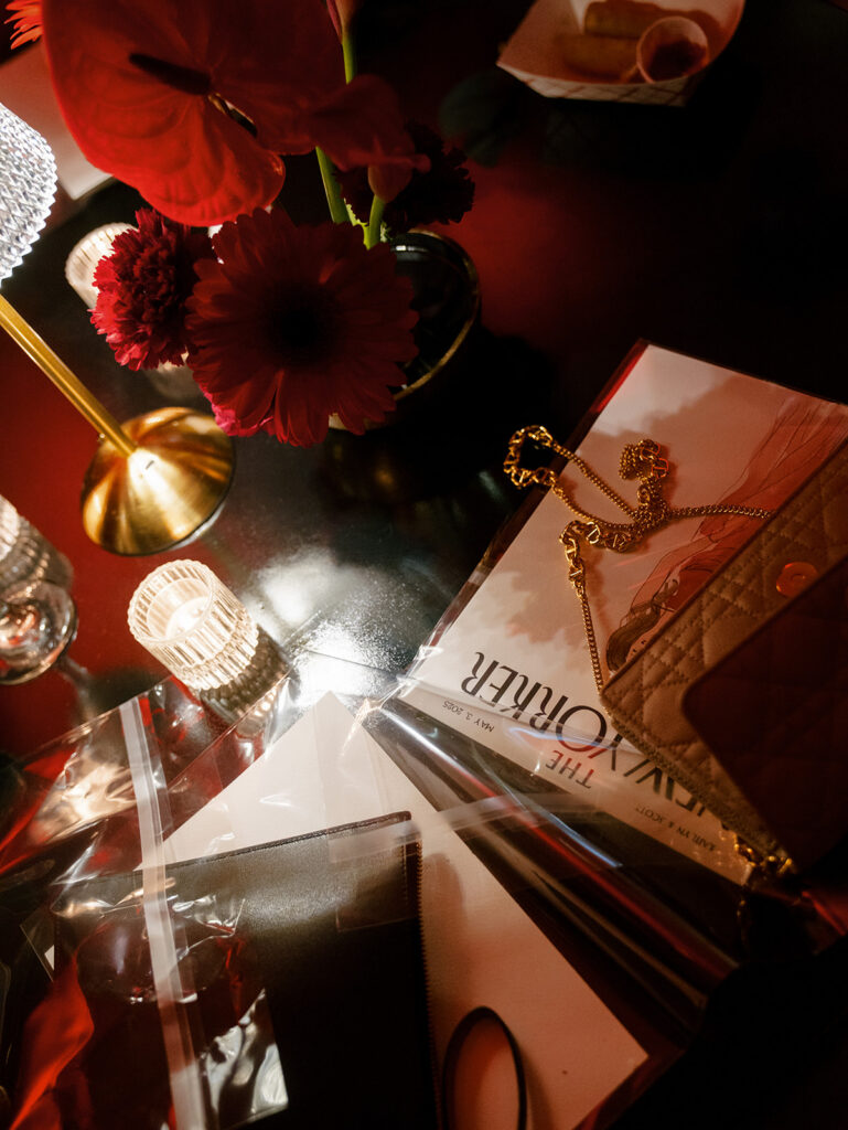 A detail photo of guests belongings on a cocktail table.