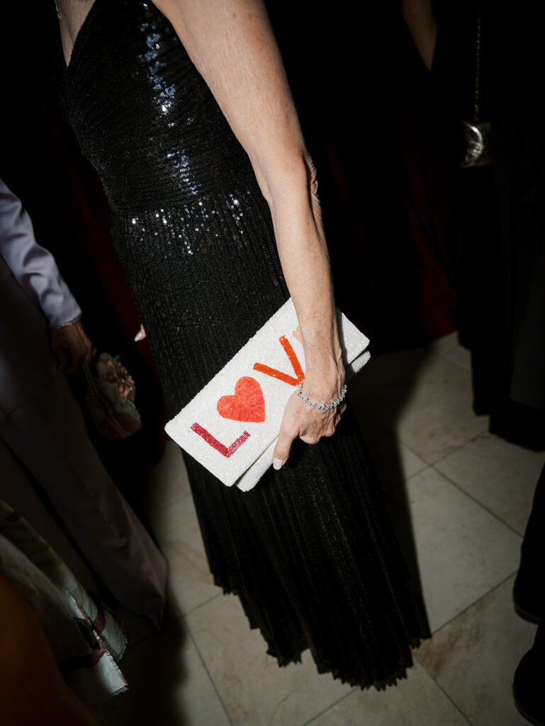 A close up detail of a guest's bag during cocktail hour.